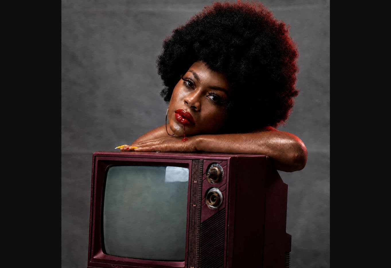 Conceptual portrait posed with a vintage television