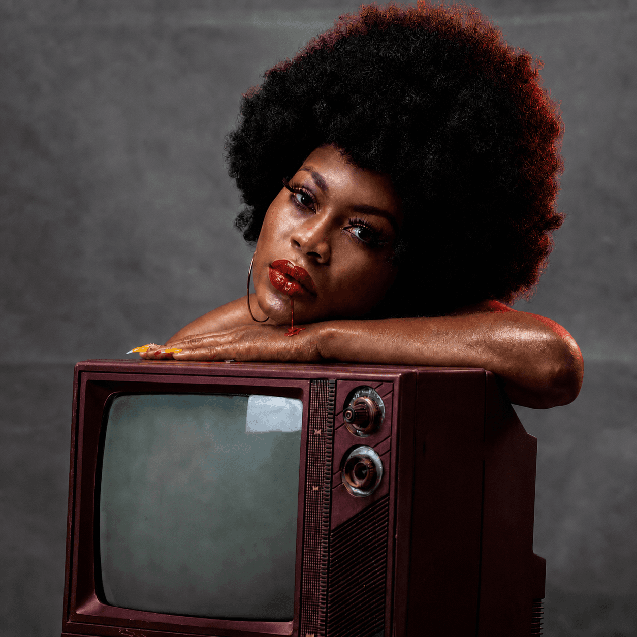 Conceptual portrait posed with a vintage television